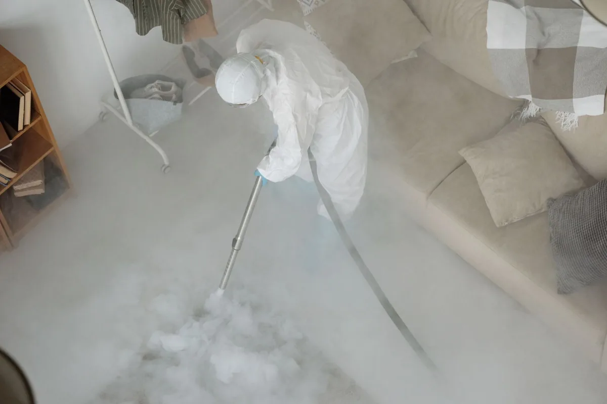 Biohazard cleanup technician in protective equipment, Sodus Point, NY